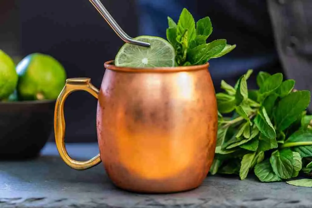 brass-colored mug with sliced lime. Moscow Mule Classy Alcoholic Drinks for Ladies